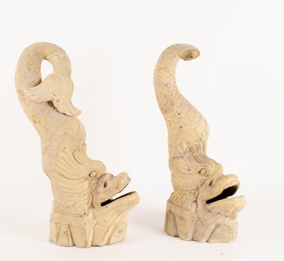 Lot 316 - A pair of carved stone dolphins with open...