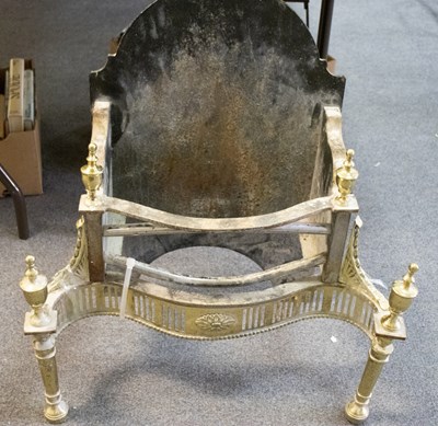 Lot 317 - A cast iron and brass fire grate of Adam...