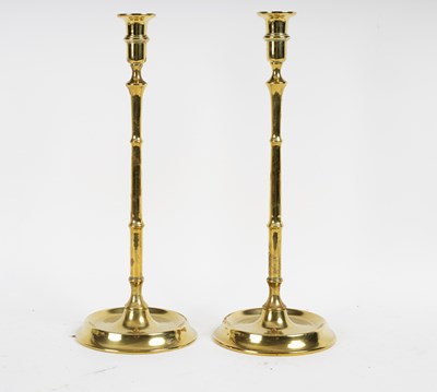 Lot 345 - A pair of Victorian brass candlesticks with...