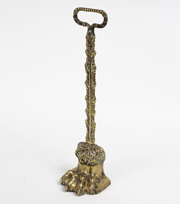 Lot 363 - A brass door porter modelled as a paw, 38cm high