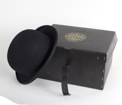 Lot 413 - A Lock & Co. black bowler hat, size 7 1/8,...