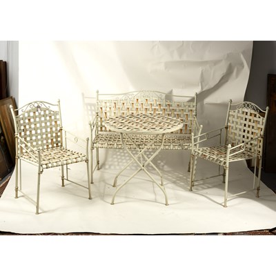 Lot 601 - A garden bench, two chairs and a table