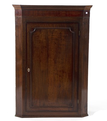 Lot 611 - A 19th Century oak hanging corner cupboard...