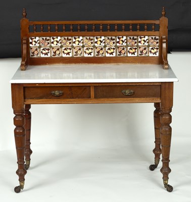 Lot 640 - A marble top washstand with spindle gallery,...