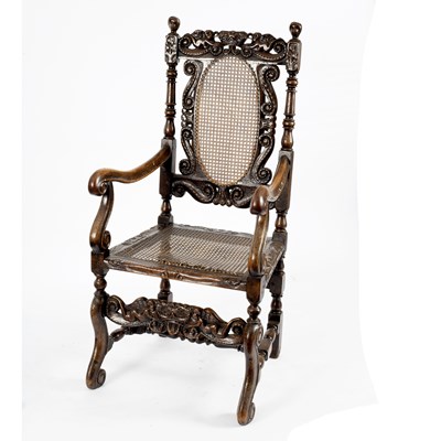 Lot 659 - A Carolean style cane seat chair with carved...