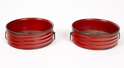 Lot 208 - A pair of Regency red lacquer wine coasters