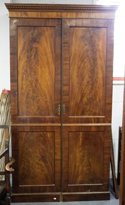 Lot 677 - A 19th Century mahogany wardrobe enclosed by...