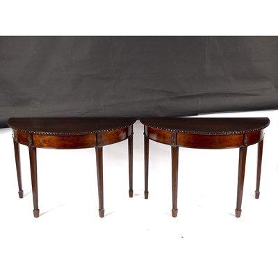 Lot 689 - A pair of George III style mahogany D-shaped...