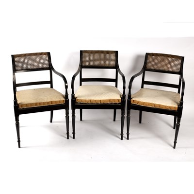 Lot 721 - Three Regency style ebonised open armchairs,...