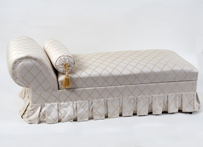 Lot 759 - A modern chaise longue, cream and gold...