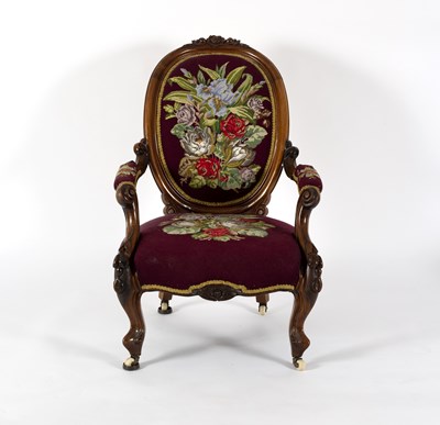 Lot 761 - A Victorian open armchair, the walnut frame...