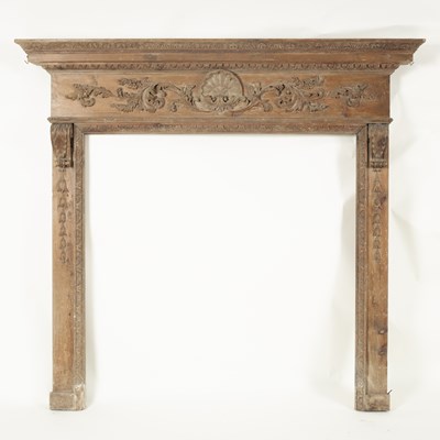 Lot 772 - A pine fire surround with shell and scroll...