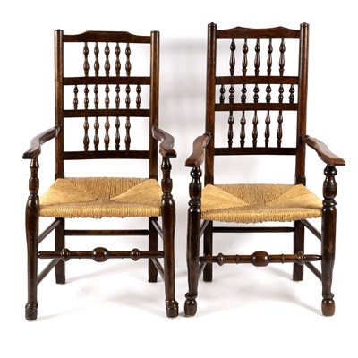 Lot 780 - Two spindle back open armchairs with rush seats