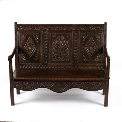 Lot 783 - A 17th Century style oak bench, the triple...