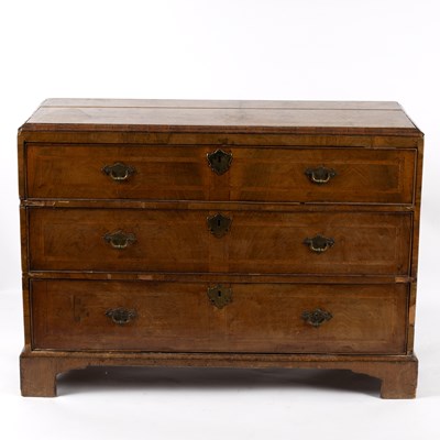 Lot 803 - An oak and walnut chest of three long drawers,...