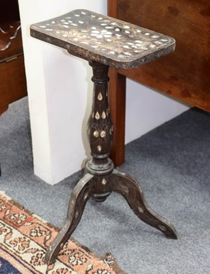 Lot 815 - A Moorish tripod table inlaid mother-of-pearl,...