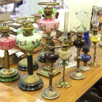 Lot 826 - A collection of fourteen oil lamps, mostly...