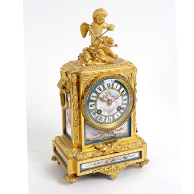 Lot 837 - A gilt metal mounted eight-day mantel clock...