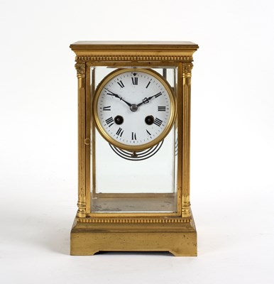 Lot 854 - A gilt brass cased four-glass clock, the...