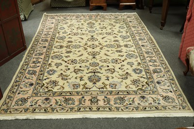 Lot 860 - A Kashan rug, the floral field to a cream...