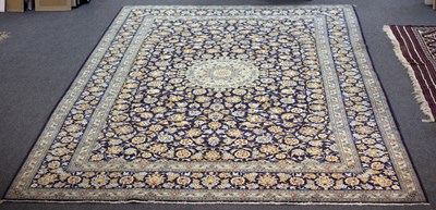 Lot 861 - A Kashan carpet, the central pale blue...