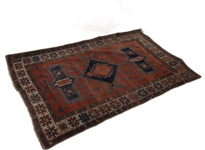 Lot 880 - A kilim rug with geometric designs to a camel...