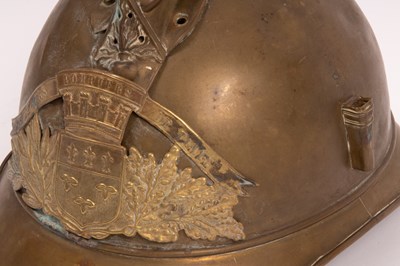 Lot 263 - A French fireman's brass helmet