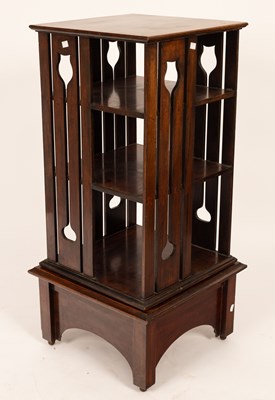 Lot 347 - An Arts & Crafts style oak revolving bookcase