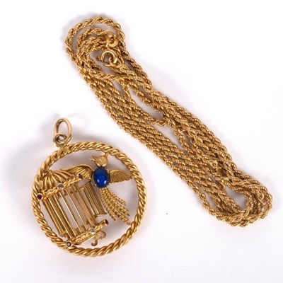 Lot 1 - An 18ct gold and gem set pendant modelled as a...