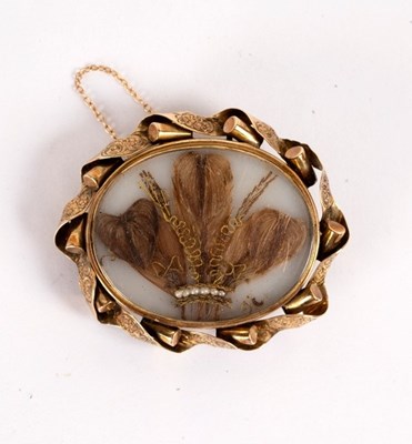 Lot 10 - A Victorian brooch, the central panel set with...