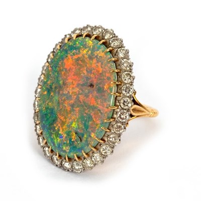 Lot 14 - An opal and diamond cluster ring, the large...