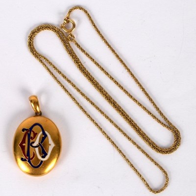 Lot 26 - An 18ct yellow gold oval locket, with monogram...