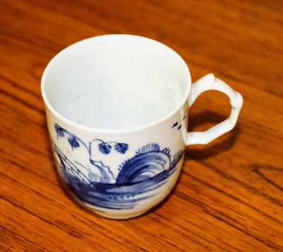 Lot 189 - A Longton Hall blue and white coffee cup,...