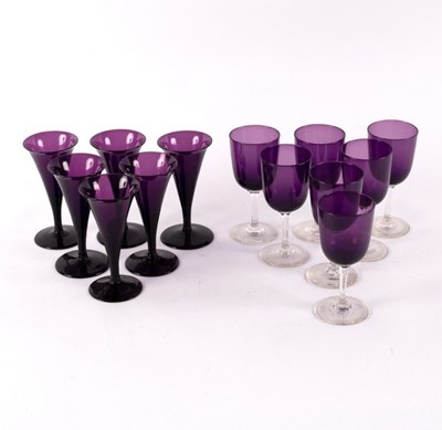 Lot 252 - Six amethyst glass wine glasses with tapered...