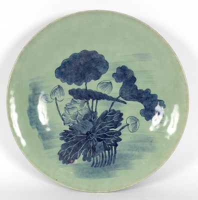 Lot 277 - A Chinese celadon plate with water lily...