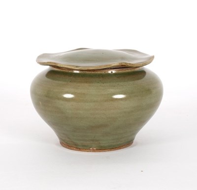 Lot 280 - A Ming celadon glaze circular pot and cover,...