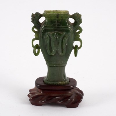 Lot 290 - A Chinese spinach jade urn of square baluster...