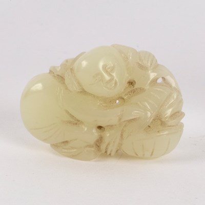 Lot 296 - A Chinese pale celadon jade carving of a boy...