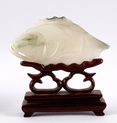 Lot 297 - A Chinese pale celadon carving of a carp...