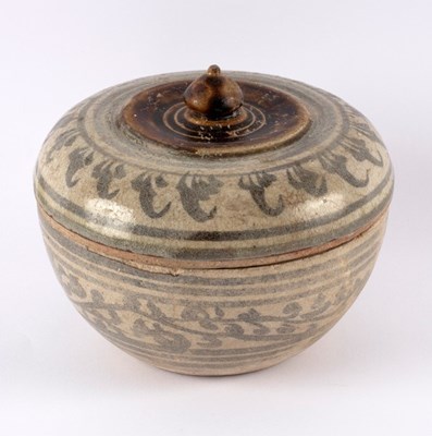 Lot 305 - A Persian pottery bowl and cover with foliate...