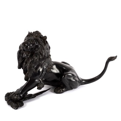 Lot 306 - A Japanese bronze figure of a lion, his prey...