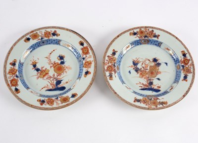 Lot 338 - A pair of Imari plates, 18th Century, painted...