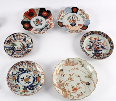 Lot 347 - Three Japanese Imari circular dishes, 18th...