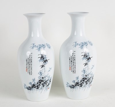 Lot 382 - A pair of Chinese vases decorated with bamboo...