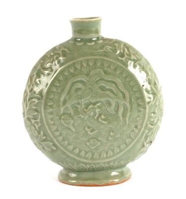 Lot 392 - A Chinese celadon moon flask, with relief...