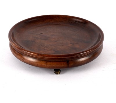 Lot 404 - A Georgian circular mahogany coaster on three...