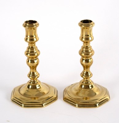 Lot 429 - A pair of French brass candlesticks, early...