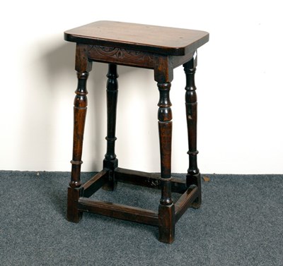 Lot 527 - An oak stool on turned legs, 97cm high and...