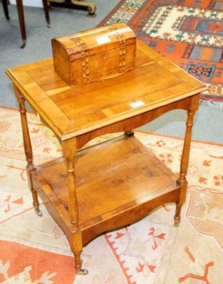 Lot 530 - A yew wood two-tier table and a tea caddy