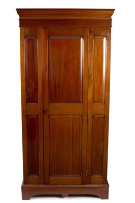 Lot 547 - A mahogany wardrobe with central panel door,...